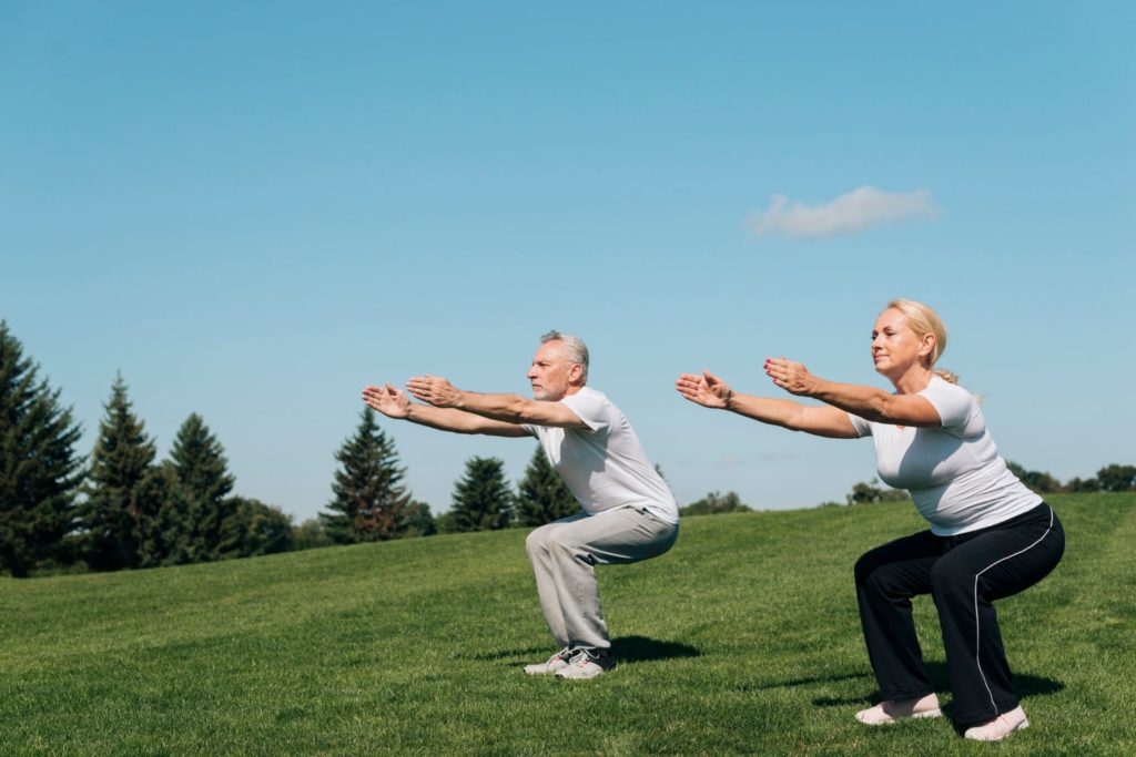 Senior couple - leg exercise