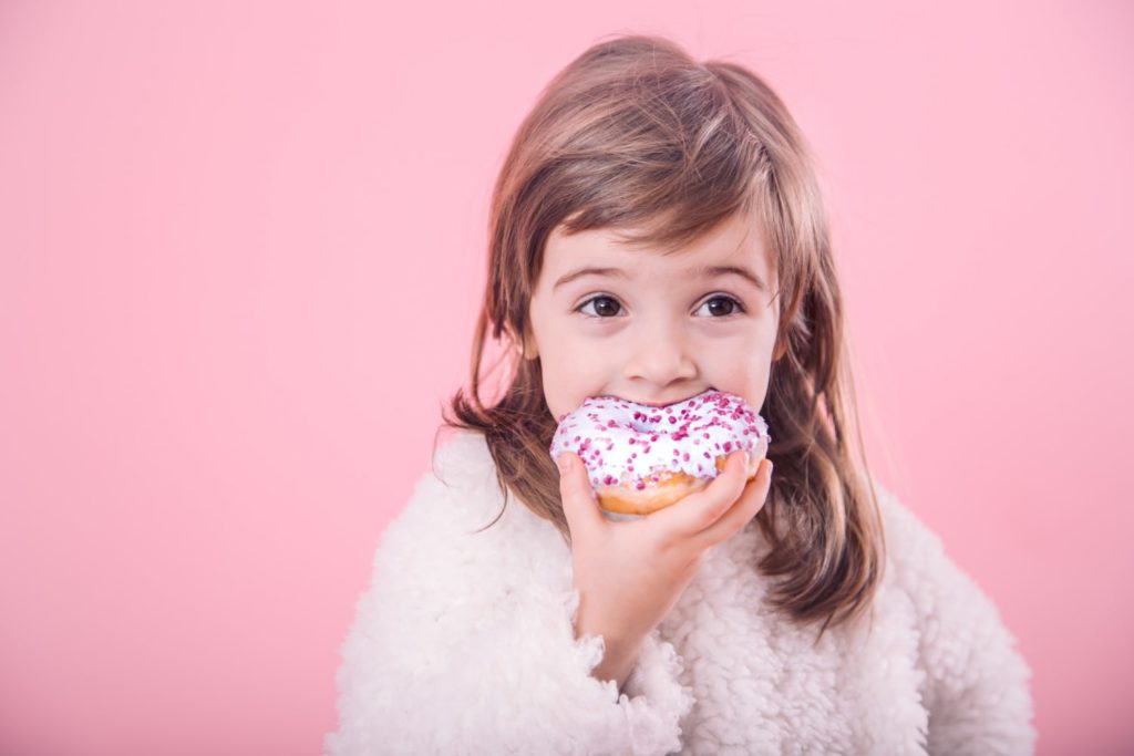 Little girl with a donut
