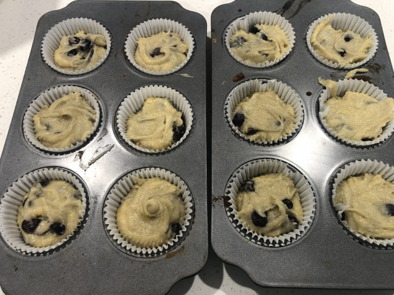 Transfer and divide the batter in muffin tins