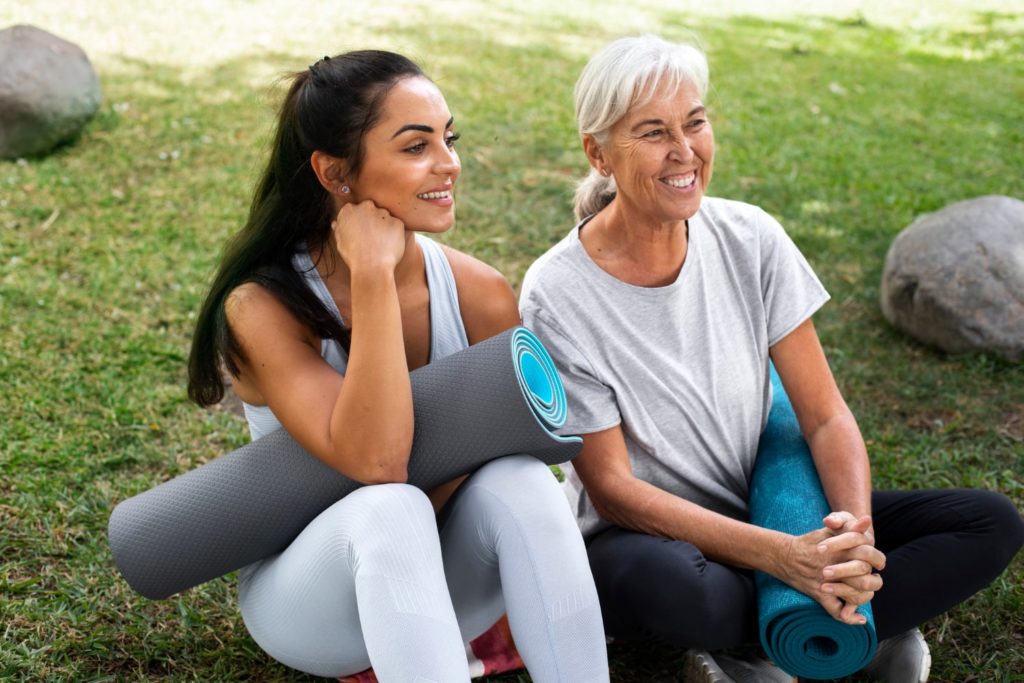 Women sitting on a yoga mat