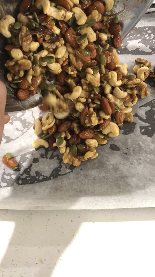 Add nuts to the lined baking sheet, lay them flat and bake for 8 minutes, then take them out and give them a stir, and bake for another 4 minutes or until golden - 1