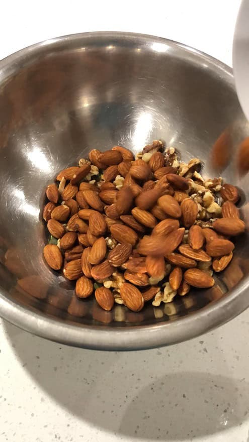 In a large bowl add cashews, almonds, walnuts and pepitas - 3