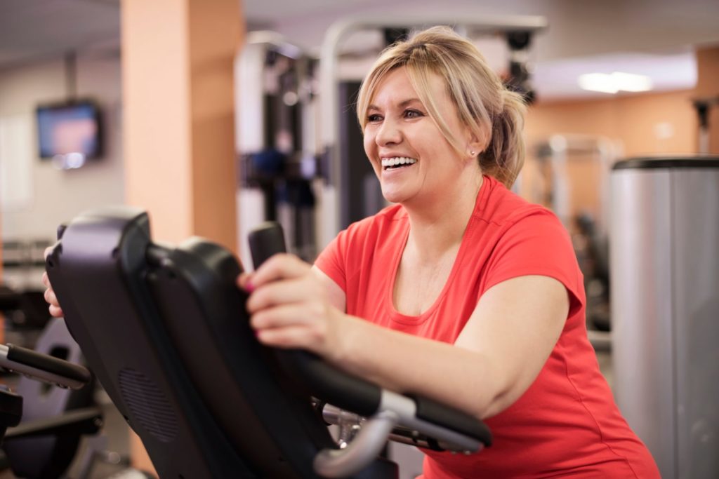 Woman riding a stationary bike