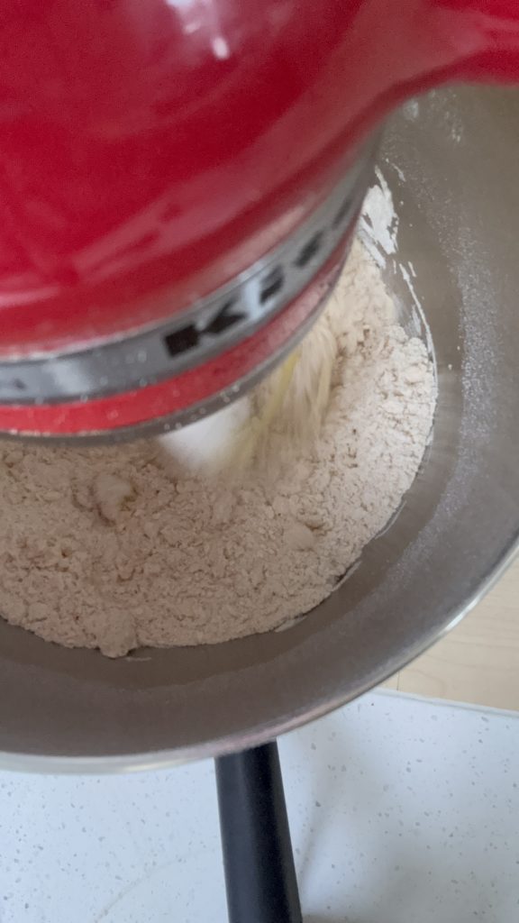 Mixing bowl of stand mixer, sift flour, icing sugar and salt