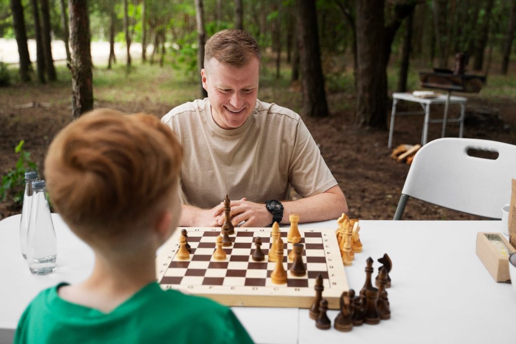 Father and son playing chess