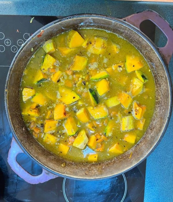 Simmer the coconut and pumpkin dal
